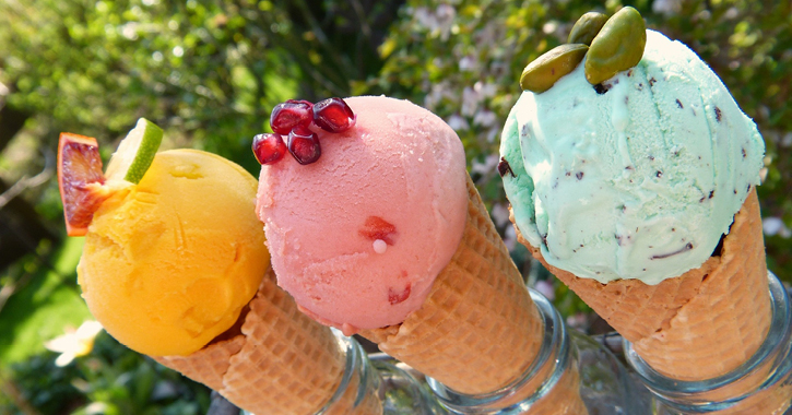 different coloured ice creams in cones 